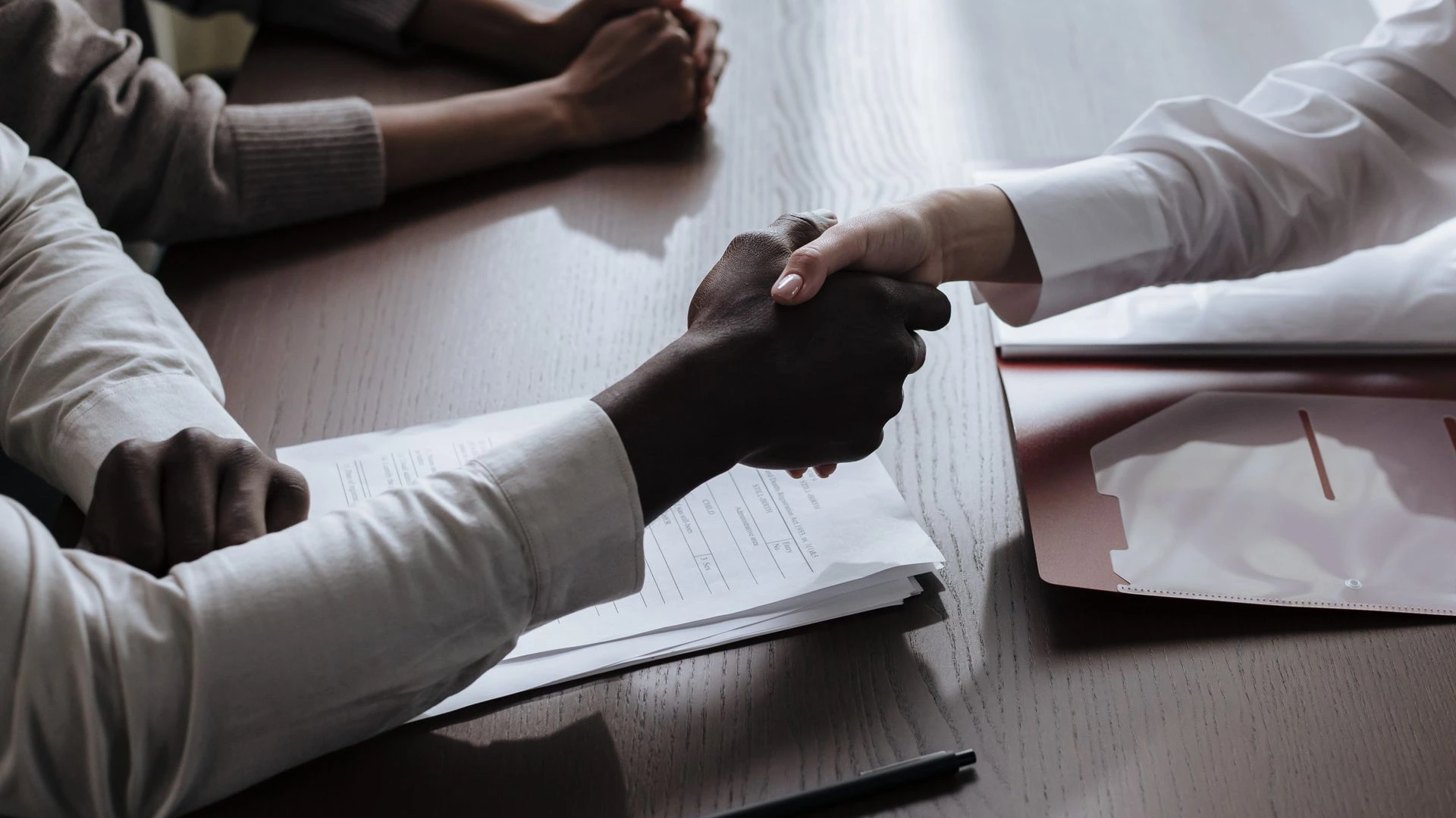Restaurant buyer and seller agreeing on a business sale price