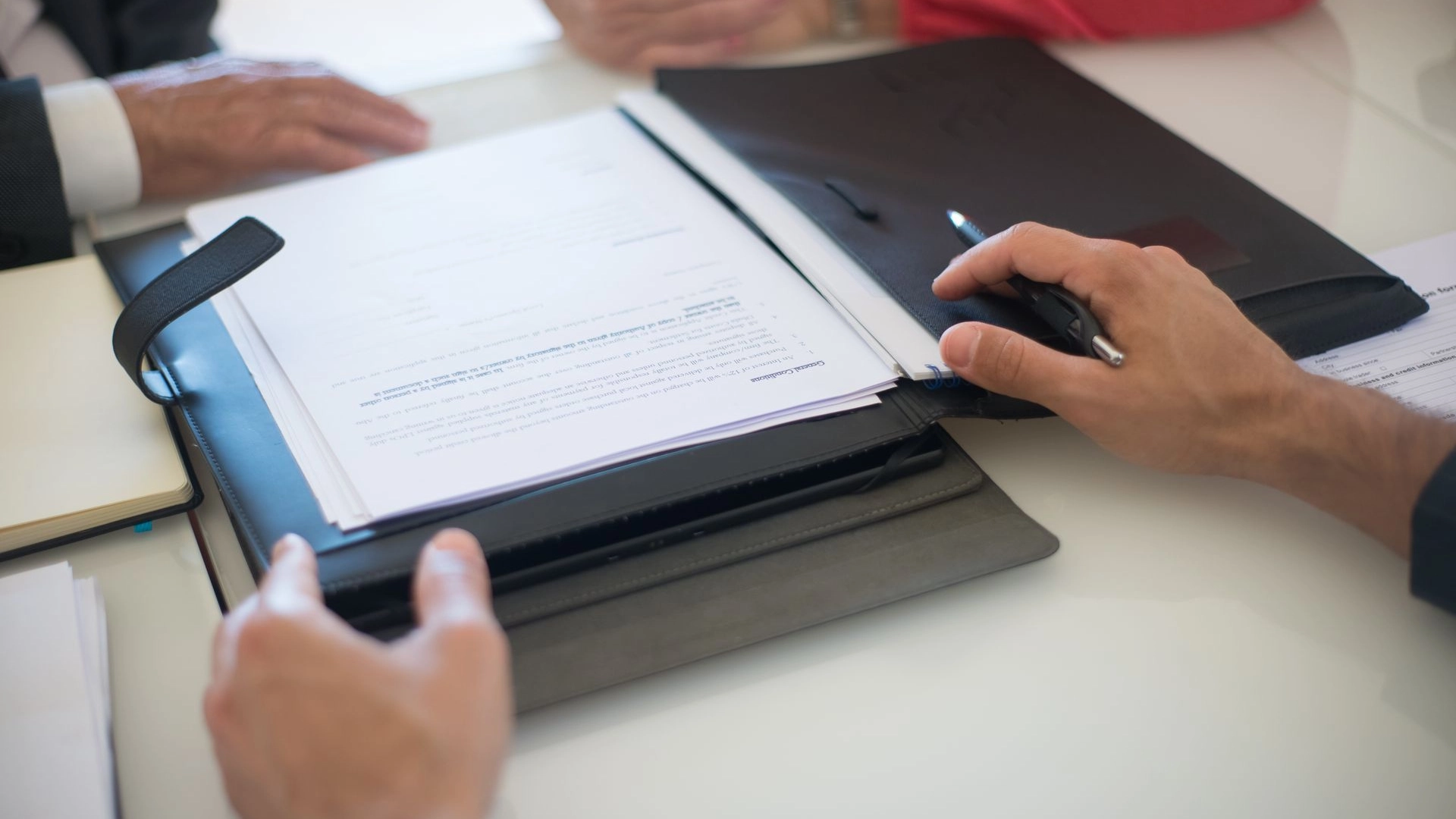 Restaurant lease documents being reviewed during a business sale