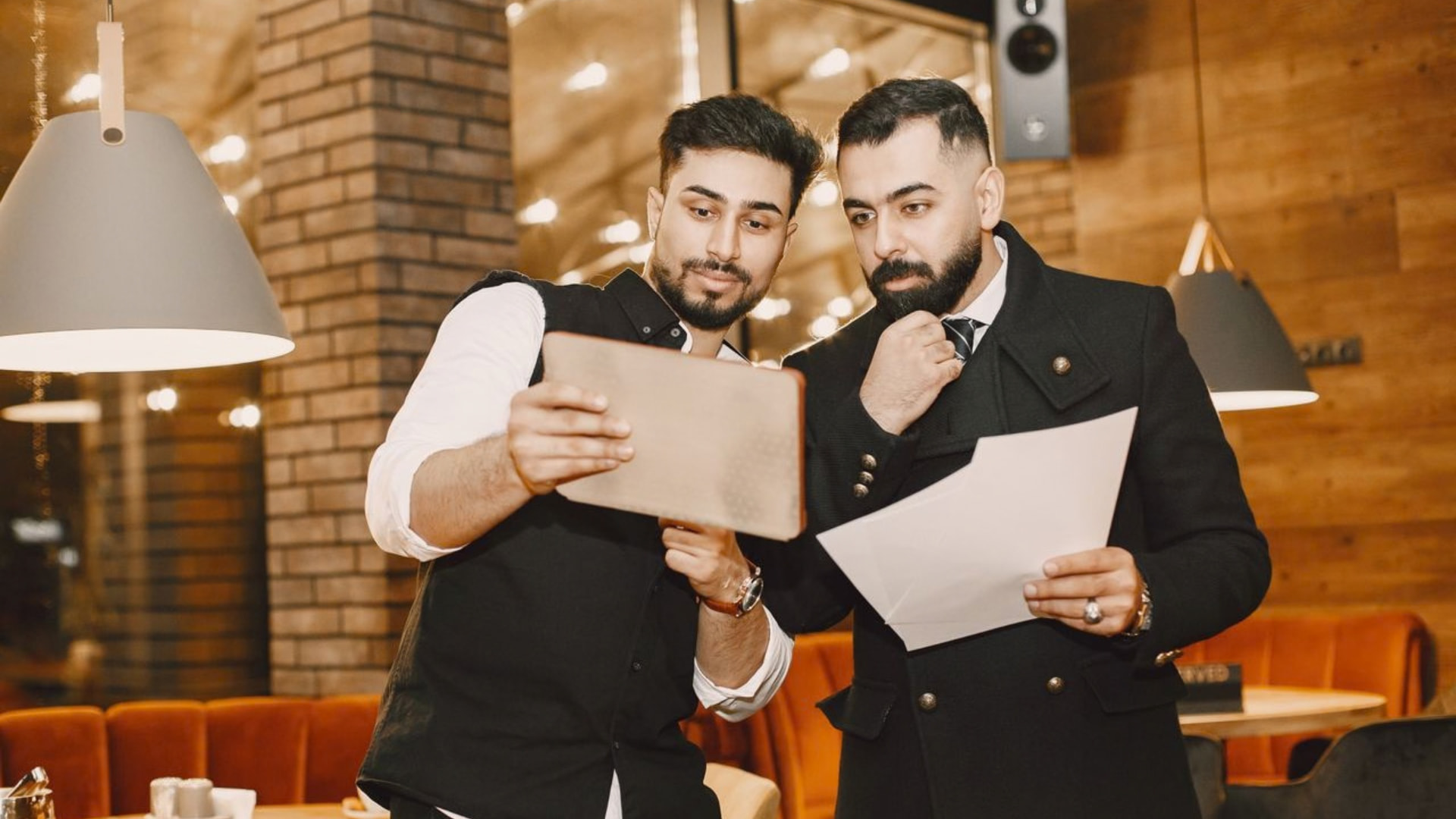 Restaurant buyer reviewing cash flow and financial documents in Vancouver